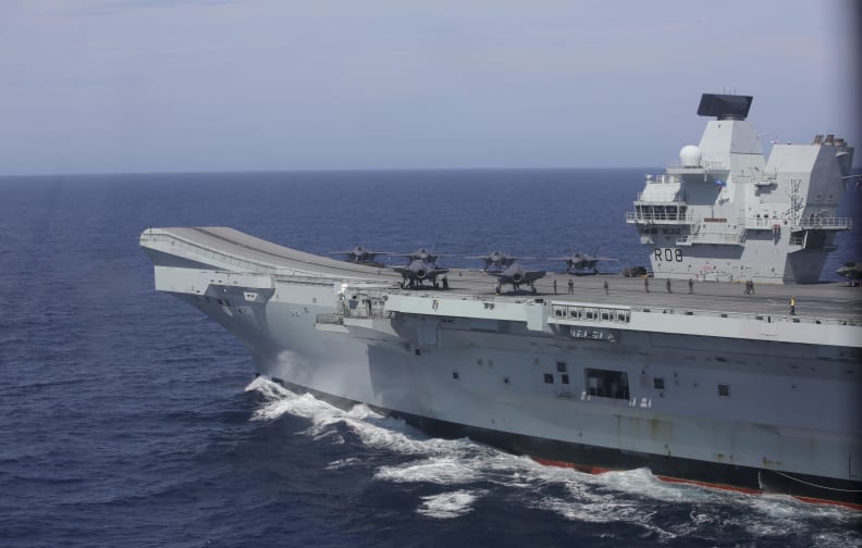 FILE - The aircraft carrier HMS Queen Elizabeth participates in the NATO Steadfast Defender 2021 exercise off the coast of Portugal, May 27, 2021. An F35 jet from a British aircraft carrier has crashed in an undisclosed location in the Mediterranean Sea. The Ministry of Defense said the jets pilot ejected safely Wednesday, Nov. 17 and returned to the HMS Queen Elizabeth. An official investigation has been opened. (AP Photo/Ana Brigida, file)