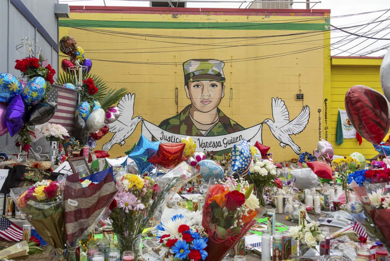 People gathered at a mural and memorial honoring Army Specialist Vanessa Guilln at Taqueria del Sol on Sunday, July 5, 2020.