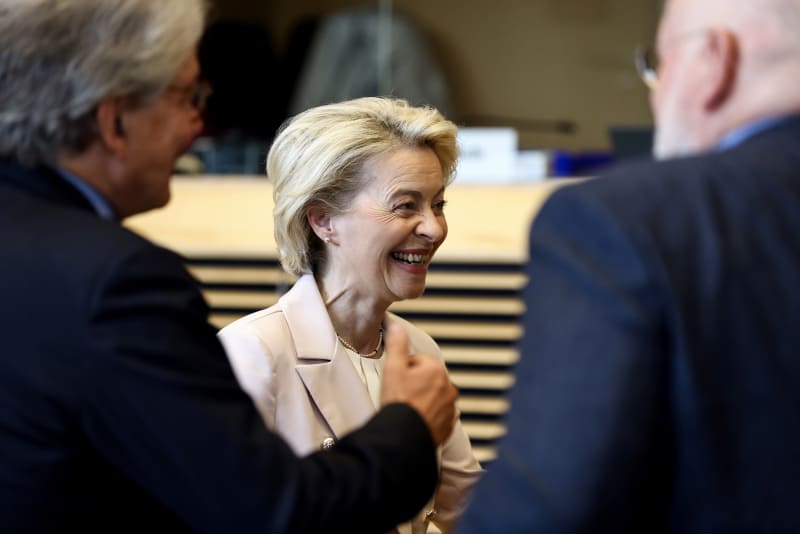 European Commission President Ursula von der Leyen, center, speaks with European Commissioner for Internal Market Thierry Breton, left, and European Commissioner for European Green Deal Frans Timmermans during the weekly College of Commissioners meeting at EU headquarters in Brussels, Wednesday, April 27, 2022. (Kenzo Tribouillard, Pool Photo via AP)