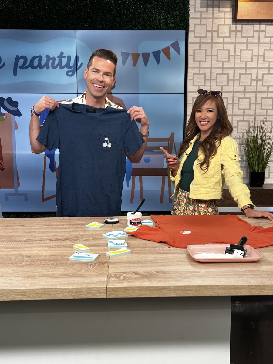 Hannah Le teaches Derrick Shore on how to block print shirts.