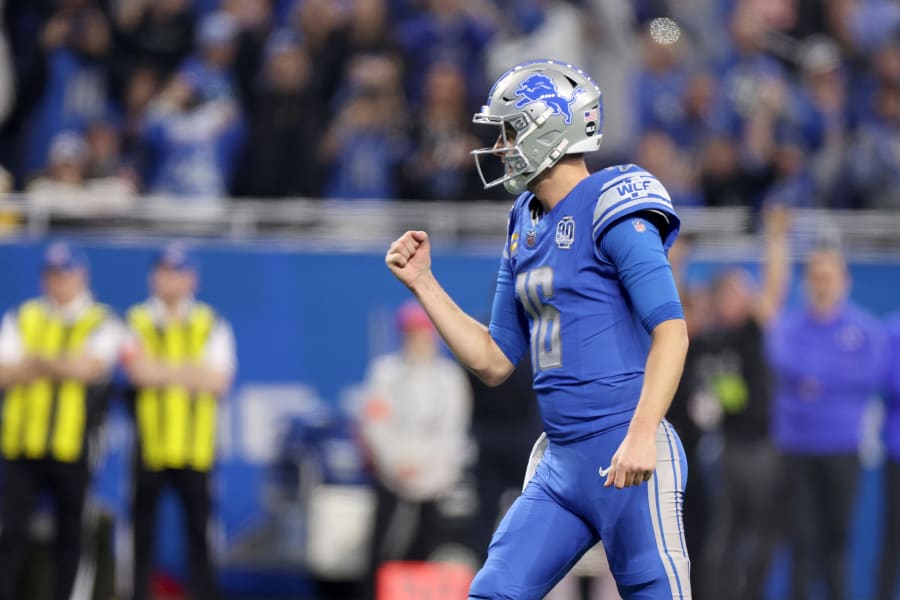 Jared Goff #16 of the Detroit Lions reacts after a touchdown during the first quarter against the Los Angeles Rams in the NFC Wild Card Playoffs at Ford Field on January 14, 2024 in Detroit, Michigan.