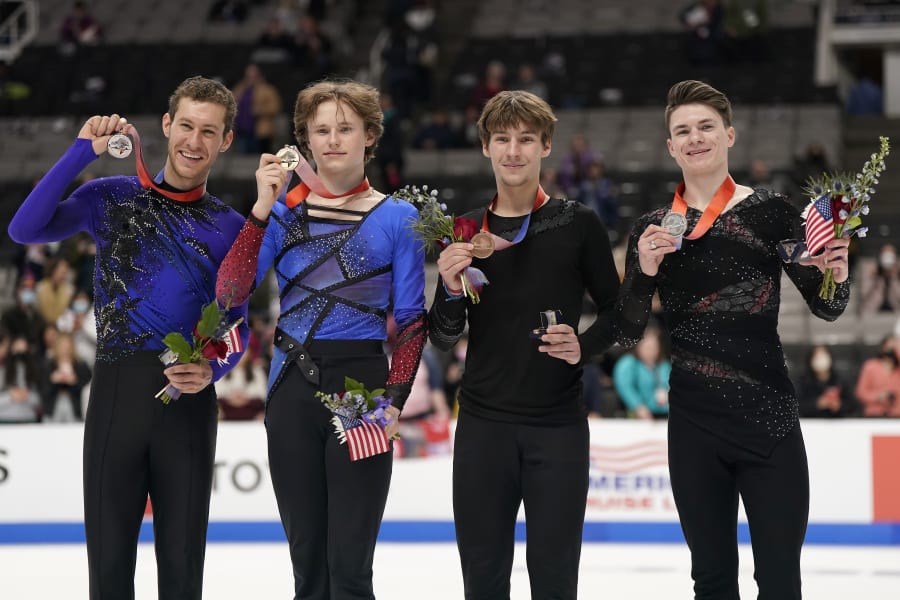 The men's division's medal ceremony - from left to right: Jason Brown (silver), Ilia Malinin (gold), Andrew Torgashev (bronze), and Maxim Naumov (pewter). (Image credit: AP Photo/Tony Avelar)