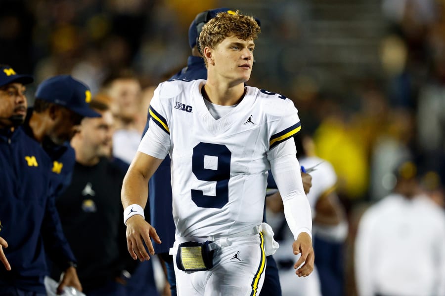 J.J. McCarthy #9 of the Michigan Wolverines looks on against the Minnesota Golden Gophers in the second half at Huntington Bank Stadium on October 07, 2023 in Minneapolis, Minnesota.