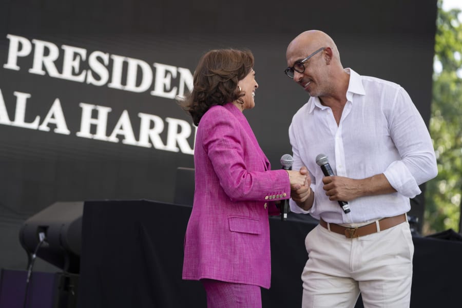 Vice President Kamala Harris is introduced by Harvey Mason Jr., CEO of The Recording Academy, during the 50th anniversary celebration of hip-hop at the vice president's residence, Saturday, Sept. 9, 2023, in Washington. (AP Photo/Manuel Balce Ceneta)