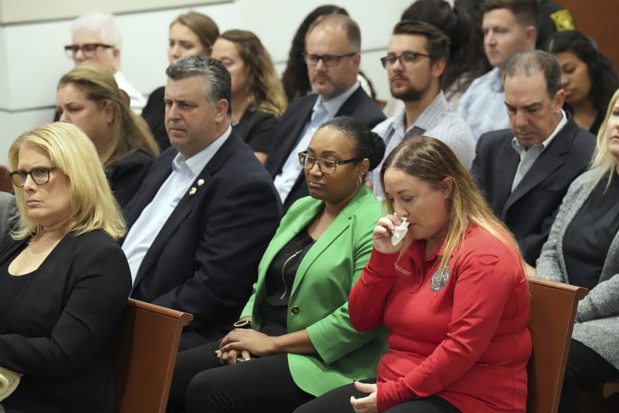 Lori Alhadeff cries as Assistant State Attorney Mike Satz details the killings in his closing arguments in the penalty phase of the trial of Marjory Stoneman Douglas High School shooter Nikolas Cruz at the Broward County Courthouse in Fort Lauderdale, Fla. on Tuesday, Oct. 11, 2022. Alhadeff's daughter, Alyssa, was killed in the 2018 shootings. Cruz previously plead guilty to all 17 counts of premeditated murder and 17 counts of attempted murder in the 2018 shootings. (Amy Beth Bennett/South Florida Sun Sentinel via AP, Pool)