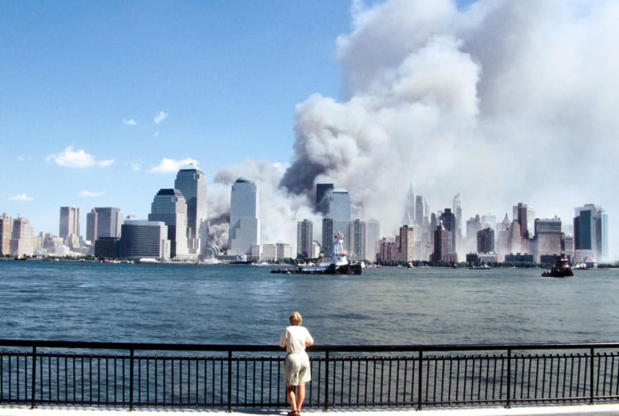 In this
                                                          file photo,
                                                          you see a view
                                                          of the
                                                          Manhattan
                                                          skyline after
                                                          a terrorist
                                                          attack that
                                                          destroyed the
                                                          Twin Towers of
                                                          the World
                                                          Trade Center.
                                                          A lone
                                                          spectator
                                                          watches the
                                                          unfolding
                                                          scene from a
                                                          safe vantage
                                                          point.