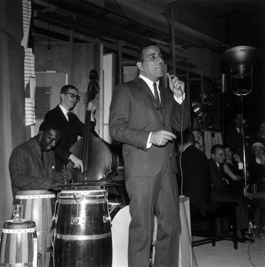 circa 1957:  American singer Tony Bennett performs on stage with American jazz drummer Art Blakey.  (Photo by Hulton Archive/Getty Images)