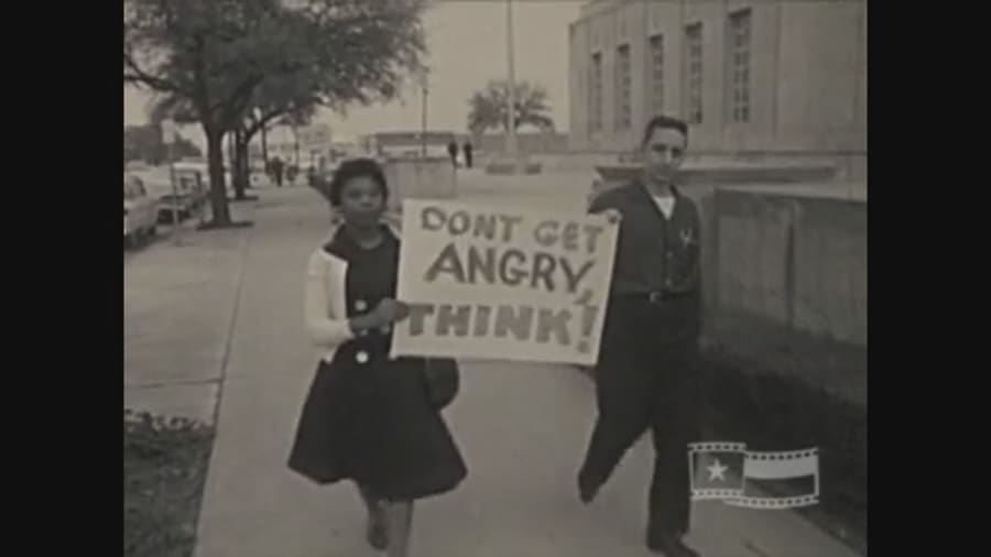 In 1960 outside Houston City Hall, demonstrators held signs calling for an end to desegregation. 