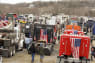 Trucks are parked at Hagerstown Speedway as the People Convoy of Truckers stages Saturday, March 5, 2022, in Hagerstown, Md. The convoy of trucks is planning to head into the Washington area.(AP Photo/Jon Elswick)