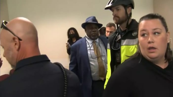 Featured image of post ‘The governor is an enemy of the people,’ well-known activist says as he’s handcuffed ahead of DeSantis news conference