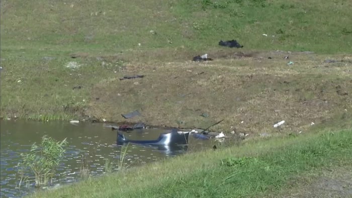 1 person hospitalized after being pulled from car that drove into canal