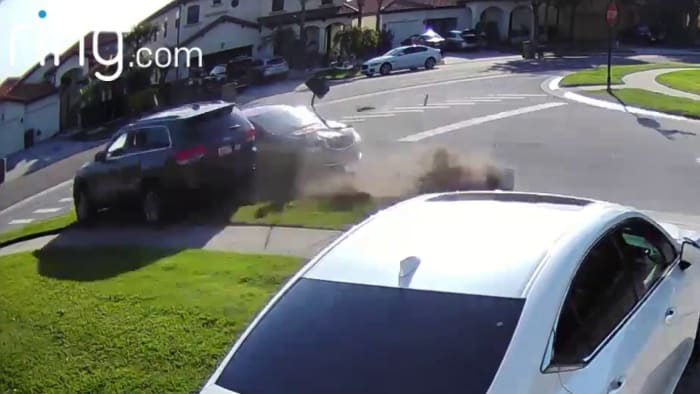 WATCH: Video shows SUV narrowly miss car before slamming into Kissimmee home in fiery wreck
