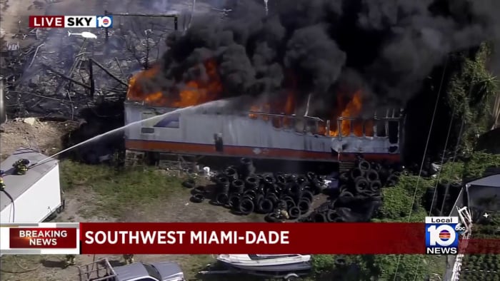 Black plumes of smoke in the air over southwest Miami-Dade