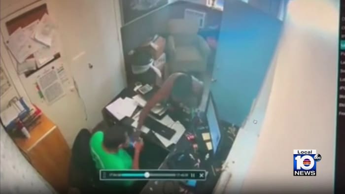 Video shows armed robber attacking hotel clerk in Miami Springs