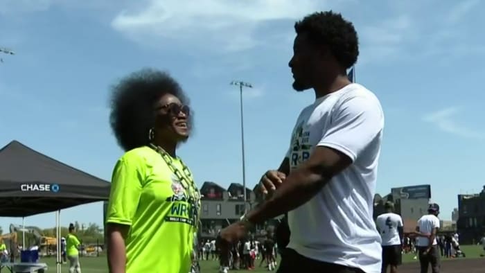 The NFL star returned to Detroit to host a free football camp for kids
