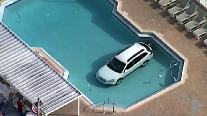 Woman drives into swimming pool at Florida country club