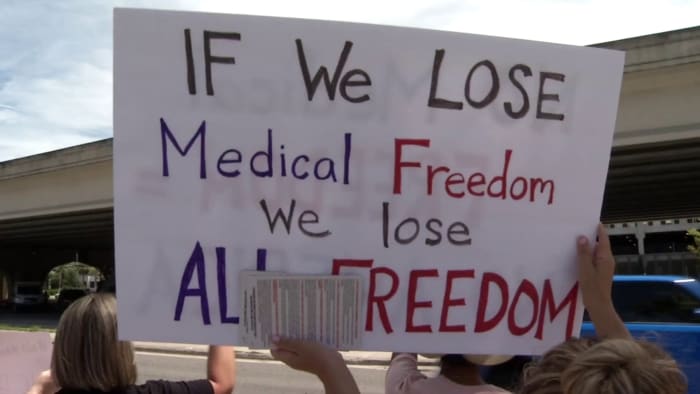 Dozens protest outside Jacksonville hospital against requirement for ...