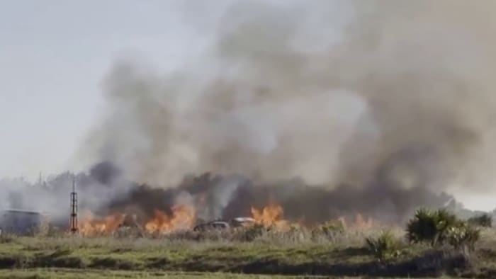 Crews battling large brush fire in Palm Bay