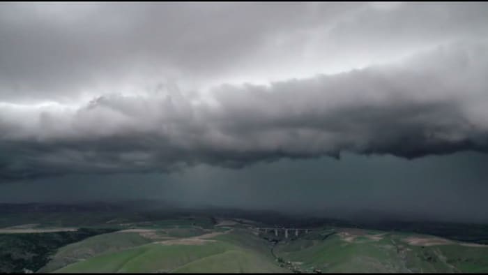 What causes the distinct smell before a rainstorm?