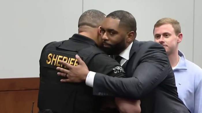 Judge addresses video of former Michigan football coach Sherrone Moore hugging deputy in courtroom