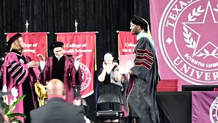 Paralyzed in 2013, Texas Woman’s University grad walks across graduation stage