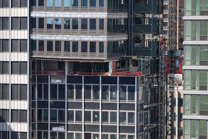 Some evacuation orders and street closures remain as work continues on a NYC high-rise that buckled