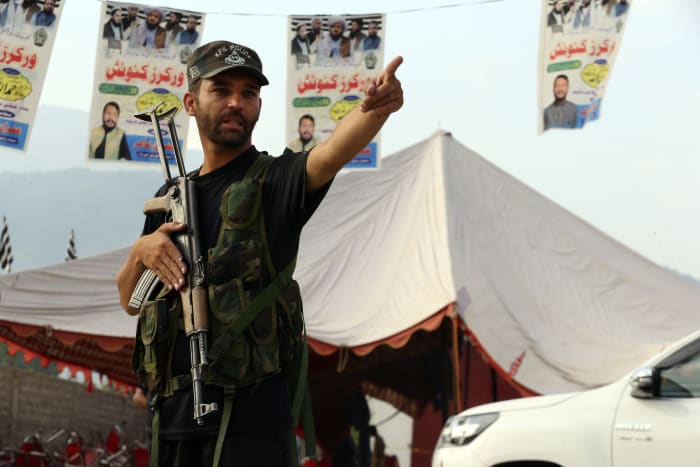 Pakistan holds funerals as government vows to hunt down those behind the weekend's suicide bombing