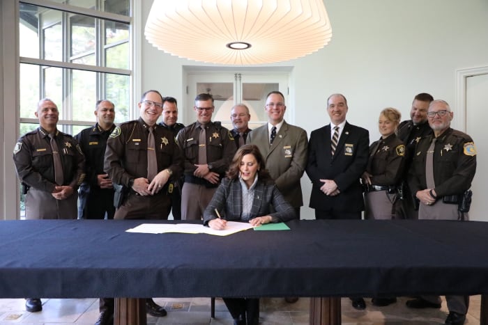 Whitmer signs bipartisan bill to boost police patrols on Michigan roads, improve officer retention