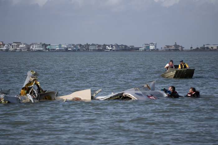 After the crash: Photos show crews searching through wreckage of downed Mexican Navy aircraft in Galveston
