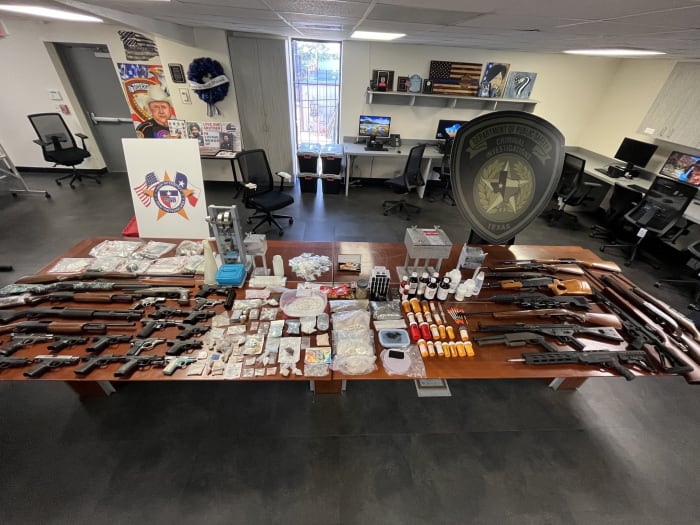 Large amount of narcotics, guns, stolen vehicles seized after search