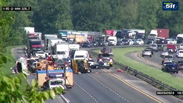 Traffic Alert: All lanes of I-95 SB near World Golf Village closed because of 2 overturned work trucks, fuel leak