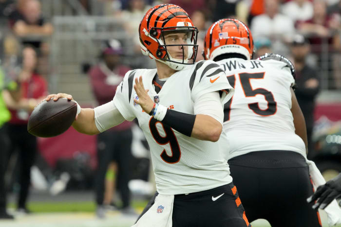 Burrow plays through calf injury, throws for 259 yards as Bengals