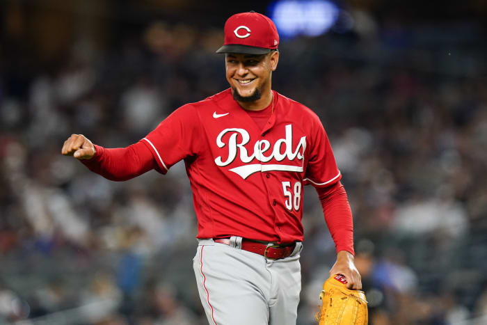 Reds shortstop Jose Iglesias sports purple hair