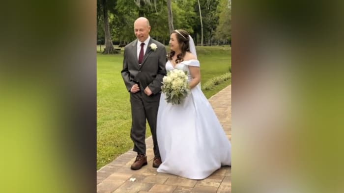 VIDEO: Watch injured Orange County deputy walk his daughter down the aisle at her wedding