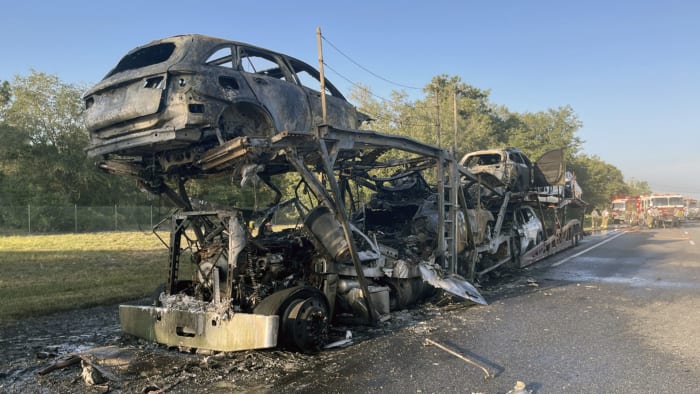 Car hauler goes up in flames, closes Beachline in Orange County, troopers say