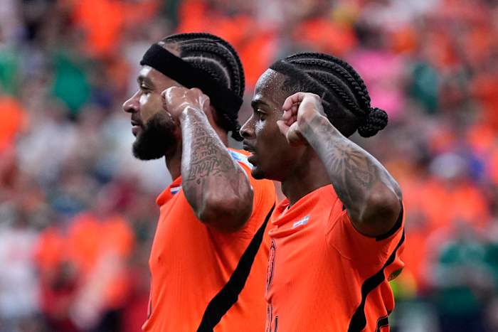 Brian Brobbey and the Dutch roll in the rain to a 3-1 win over Tunisia to top World Cup Group F