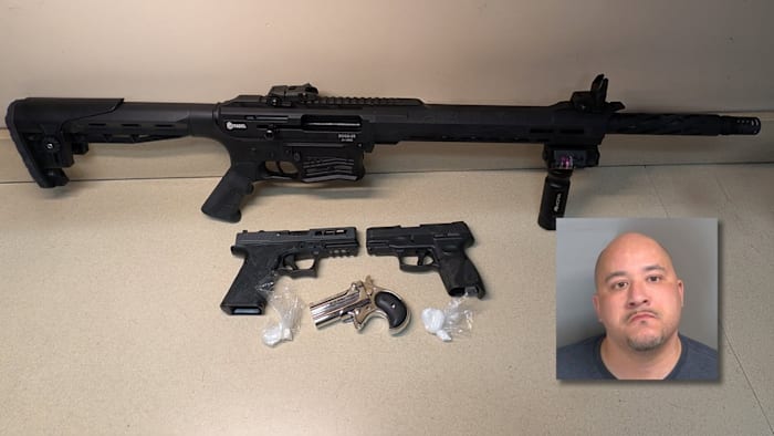 A Macomb County man was banned from having guns. Police say they found several at his home -- and cocaine