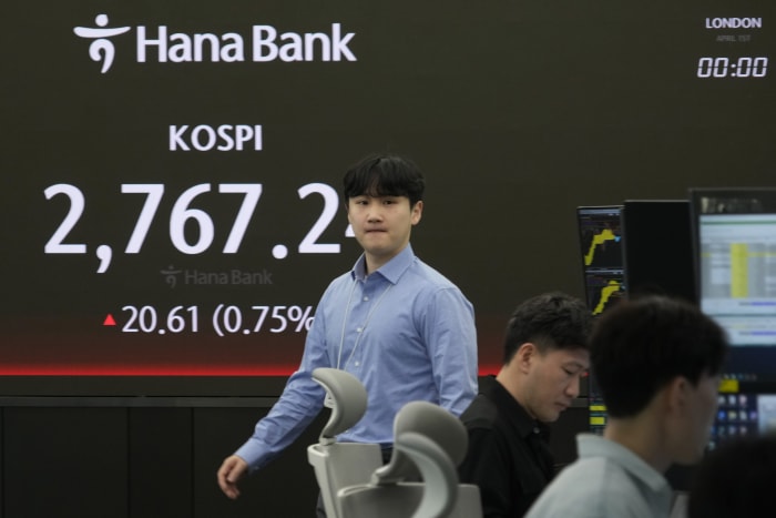 Asian shares are mixed and Shanghai gains on strong China factory data