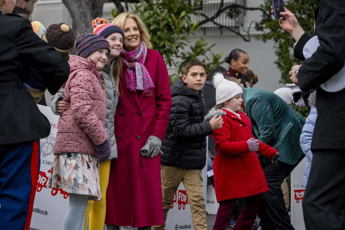 Jill Biden and military kids sort toys the White House donated to the Marine Corps Reserve program