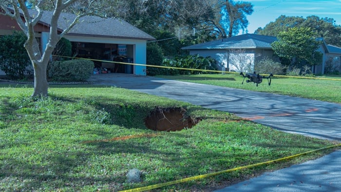 60-foot-deep sinkhole opens in lawn of Polk County home