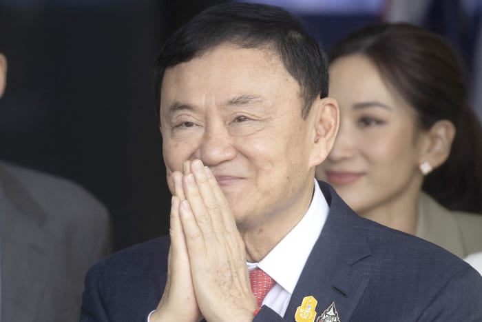 Thailand's king reduces prison term of former Prime Minister Thaksin Shinawatra to a single year