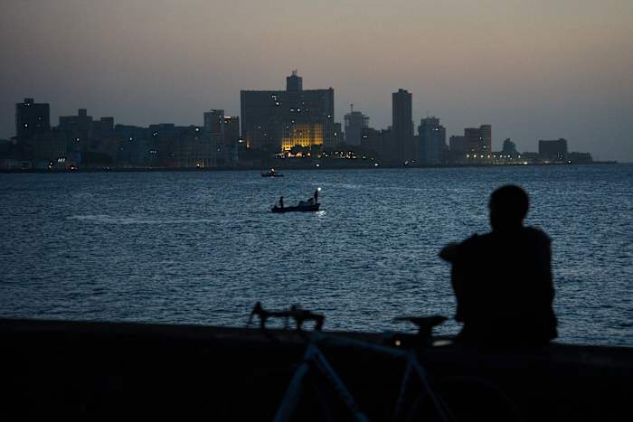 Cubans sleep on seaside boardwalk to seek relief from crippling blackouts and summer heat