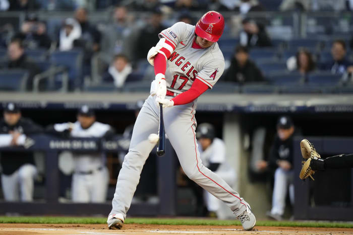 New York Yankees Derek Jeter looks at his bat before stepping into the box  in the first inning against the Philadelphia Phillies in game 2 of the World  Series at Yankee Stadium