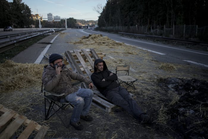 France's government prepares new measures to calm farmers' protests, with barricades squeezing Paris