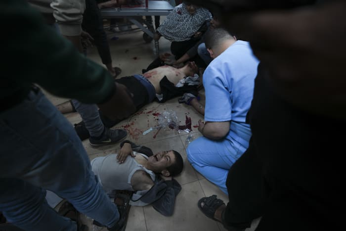 Palestinians flee from central Gaza's main hospital as fighting draws closer and aid groups withdraw