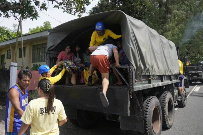 Philippine villagers flee ashfall, sight of red-hot lava from erupting Mayon volcano