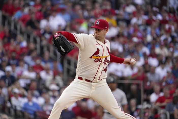 Cardinals reliever Gallegos gets wiped down by umpire after using rosin bag  on his left arm