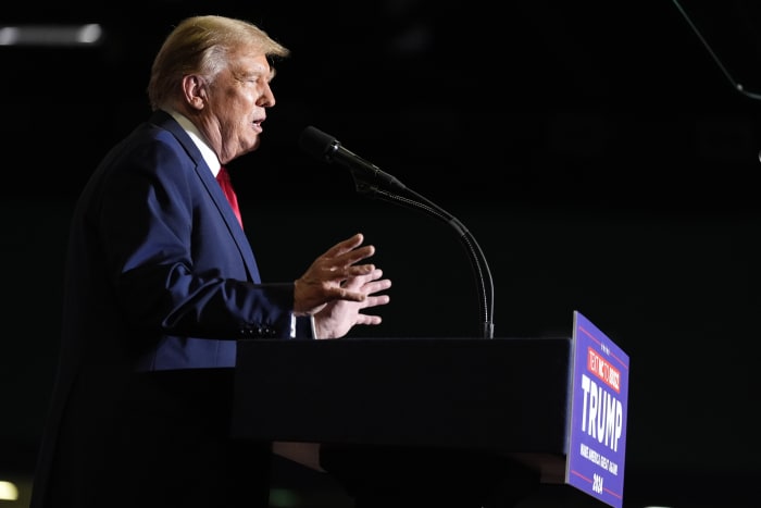Trump escalates his immigration rhetoric with baseless claim about Biden trying to overthrow the US
