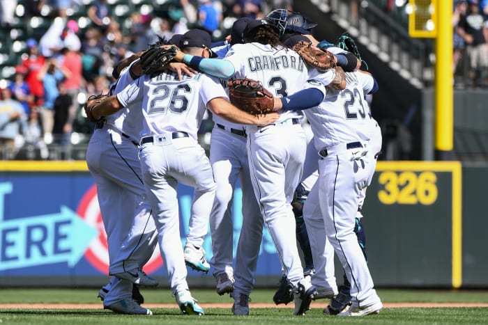 Seattle Mariners' Ty France (23) and Kyle Seager celebrate after a baseball  game against the Houston