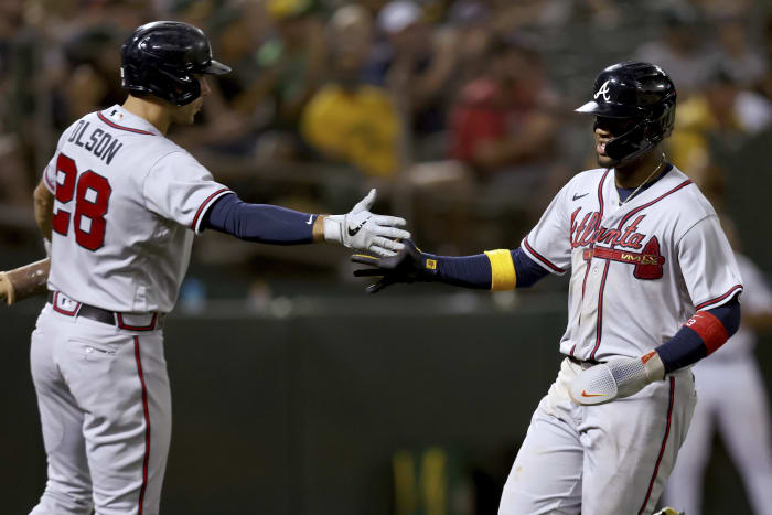 Braves star Albies carried away after fouling ball off knee